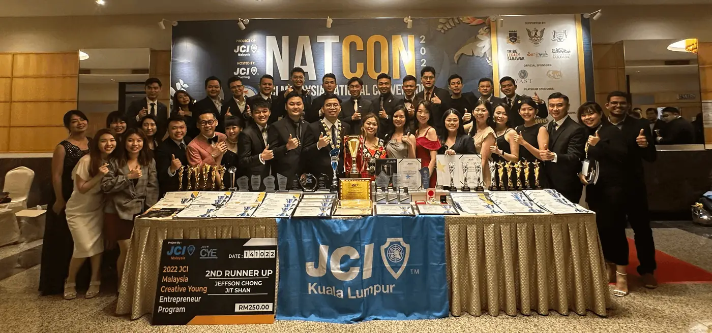 The JCI Kuala Lumpur delegation holding trophies at the JCI Malaysia National Convention 2024